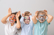 © Pixel-Shot - Funny children with face painting on light background