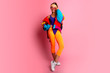 © ClaudiK - Full length image of 80's Fashion woman over pink background. Beautiful athletic girl in 80s style sportswear, fashionable woman in bright body suit