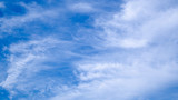 Fototapeta Niebo - blue sky horizontal with beautiful puffy fluffy clouds with sunlight, abstract nature background