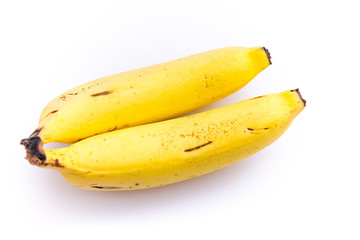 a bright yellow ripe banana isolated from a white background and copy space