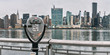 Panorama of tourist binoculars with Manhattan, New York City skyline in the background