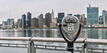 Panorama Of Tourist Binoculars With Manhattan, New York City Skyline In The Background