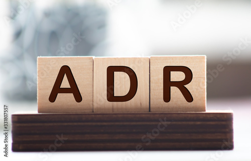 Fotografía Letter block in word ADR Abbreviation of adverse drug reaction on wood backgroun