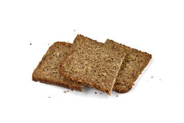 Poster - Slices of wholemeal dark bread isolated on a white background in close-up 