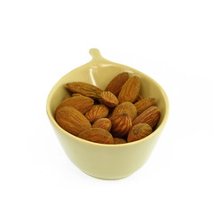 Wall Mural - Almonds in a bowl isolated on white background.