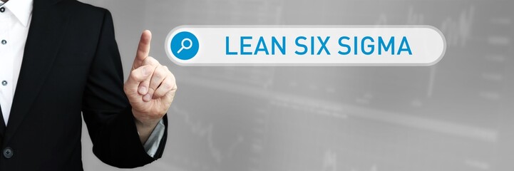 Lean Six Sigma. Man in a suit points a finger at a search box. The word Lean Six Sigma is in the search. Symbol for business, finance, statistics, analysis, economy
