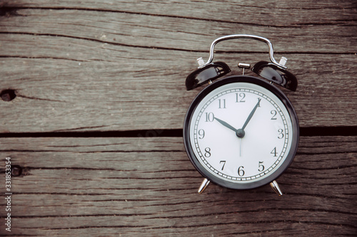 Cuadros en Lienzo old clock place on wooden background with space for text for times memory concept