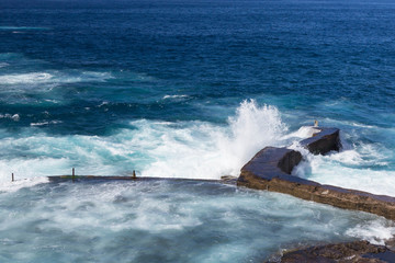 Wall Mural - wave splashes on stones at Tenerife island, Spain, Canary islands