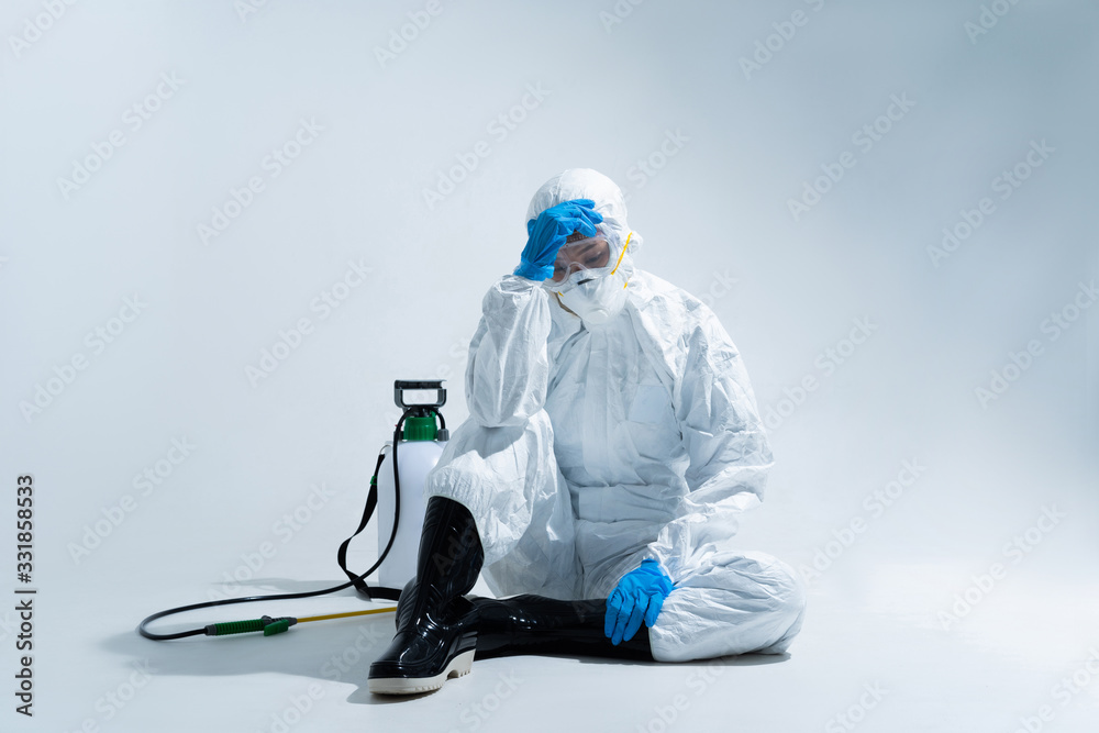 female virologist, wearing PPE. She is feeling hopeless and tired. - obrazy, fototapety, plakaty 