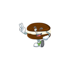 Sticker - A joyful whoopie pies mascot design showing his two fingers