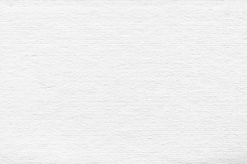 Cardboard white texture close-up. Light old paper background. Grunge concrete wall. Vintage blank wallpaper.