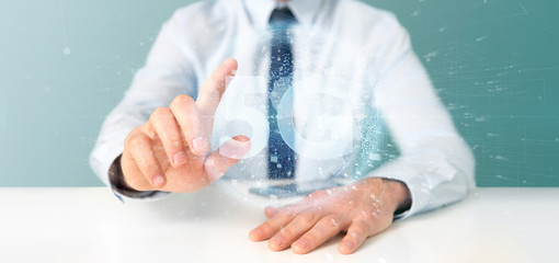 Poster - Businessman holding a 5G connection with data surrounding - 3d rendering
