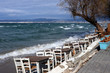 Peraia beach, suburb of Thessaloniki, Greece. White chairs and tables by the sea 