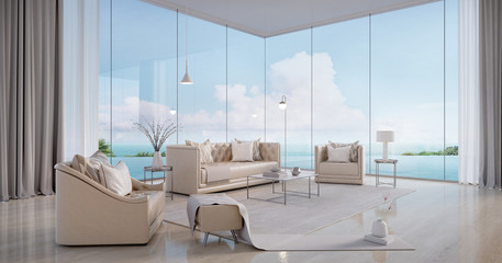 luxury beach house.sofa,armchair,stool,side table,lamps,curtains in living room with infinity edge s