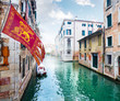 Venice picturesque canal and  Venetian Republic Flag