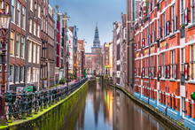 Amsterdam, Netherlands Canals And Church Tower At Dawn.