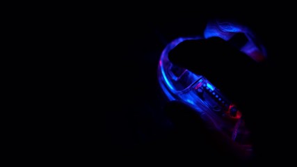 Closeup hot of clicking at a computer mouse with dark background