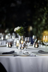 beautiful table set for an event party or wedding reception . restaurant interior