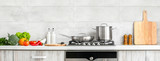 Fototapeta Lawenda - Modern kitchen countertop with domestic culinary utensils on it, home healthy cooking concept banner