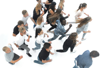 Wall Mural - top view. a group of young people walking together in a row.