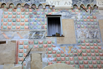 Wall Mural - Finalborgo (SV), Italy - December 12, 2017: A painted wall on a house in Finalborgo village, Finale Ligure, Liguria, Italy