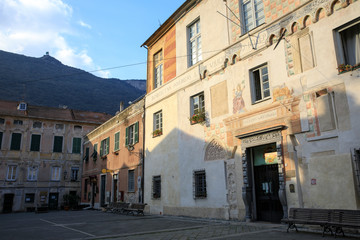 Wall Mural - Finalborgo (SV), Italy - December 12, 2017: The National Palace and the square in Finalborgo village, Finale Ligure, Liguria, Italy