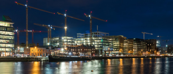 Wall Mural - Beautiful night view scene Dublin city center old town Ireland cityscape reflection river Liffey  long exposure Samuel Beckett Bridge