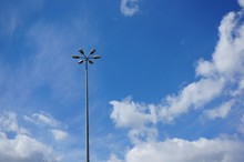 Tall Street Lamp With Sic Lamps And A Clear Blue Sky