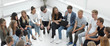 © ASDF - large group of diverse young people sitting in a circle