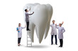 © Elnur - Doctors examining giant tooth in dental concept
