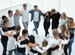© ASDF - group of casual young people standing in a circle