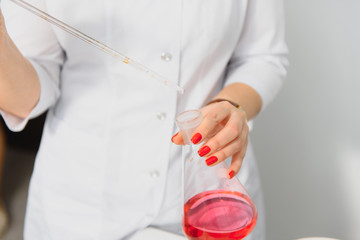 Scientists are pouring medicine from capsules in a medicine grinding cup on white isolate background,