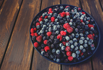 Wall Mural - frozen raspberries, blackberries and blueberries close up