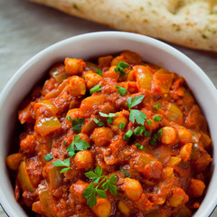 Wall Mural - Chickpea Vegetarian Curry  -  Chana Masala with Naan Bread.