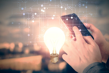 Aufkleber - Double exposure of man's hands holding and using a digital device and bulb hologram drawing. Idea concept.