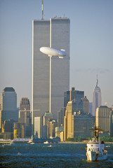 Fototapete - World Trade Towers with Good Year Blimp in foreground, New York City, NY