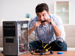 Frustrated man with broken pc computer