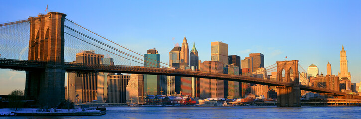 Fototapete - Panoramic view of Brooklyn Bridge and East River at sunrise with New York City, NY skyline post 9/11 view