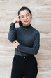© Allen Chen - A young business woman smiles at the camera