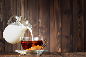 flying jug pouring milk into cup