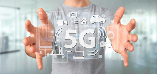 Poster - Businessman holding a 5G connection with data surrounding - 3d rendering