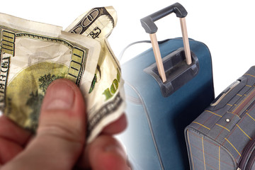 Poster - suitcases on wheels against a crumpled hundred-dollar bill. unplanned expenses during the trip. fee 