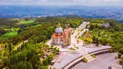 Canvas Print - Braga, Portugal. Aerial view of Sameiro Sanctuary in Braga, Portugal during the sunny day. Panning time-lapse of popular landark with nature around it