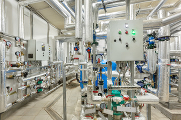 interior of an industrial boiler house, technological unit with many sensors, indicators and valves