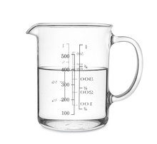 Measuring cup with clear water isolated on white