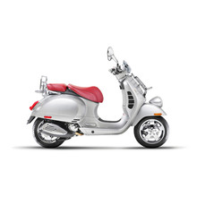 Side View Of Steel Retro Scooter Isolated On White Background. Vintage Motor Scooter. Metallic Electric Scooter. Motorcycle With Red Seat Cover. Modern Personal Transport. Classic Scooter