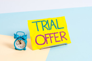 Aufkleber - Handwriting text Trial Offer. Conceptual photo A temporary free or discounted offer of a product or services Mini size alarm clock beside a Paper sheet placed tilted on pastel backdrop