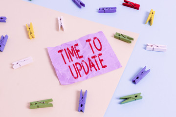 Wall Mural - Text sign showing Time To Update. Business photo showcasing this is right moment to make something more modern new Colored clothespin paper empty reminder yellow blue floor background office