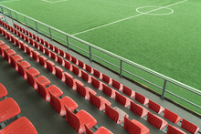 Empty Rows With Red  Seats On A Football Stadium