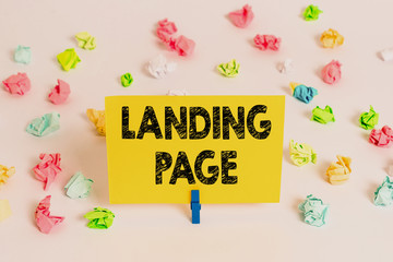 Fototapete - Handwriting text Landing Page. Conceptual photo Web page that a user arrives at after clicking a hyperlink Colored crumpled papers empty reminder white floor background clothespin